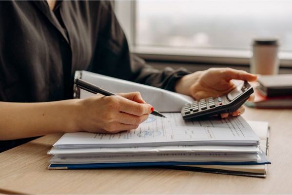 credit score calculations image of person with calculator
