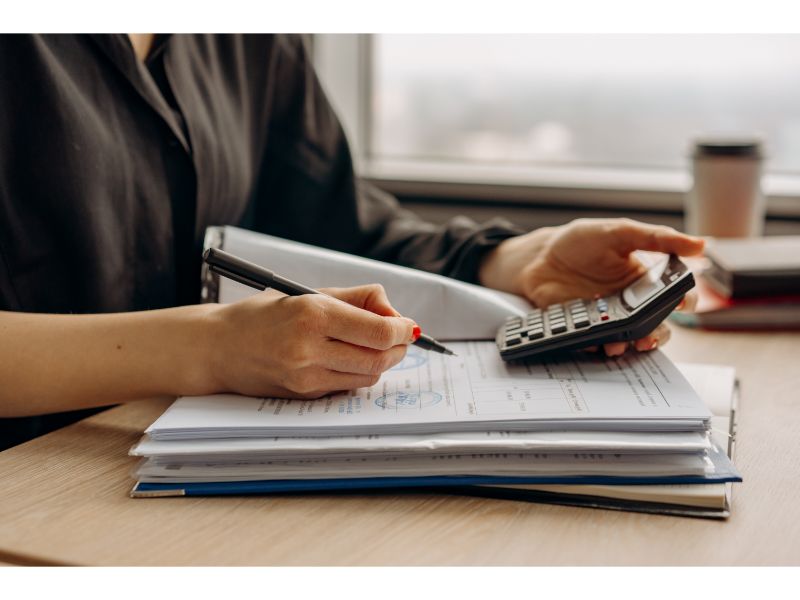 credit score calculations image of person with calculator