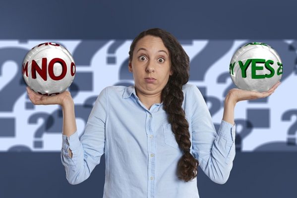 lines of credit vs personal loans woman with yes no signs