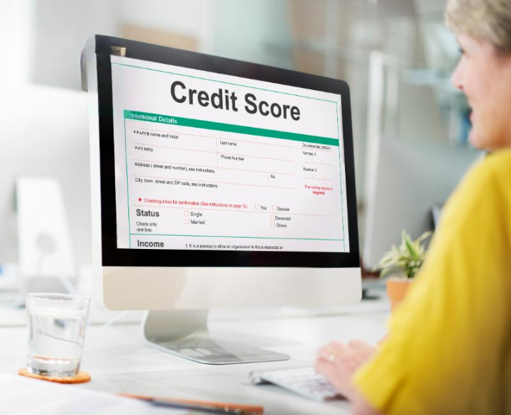 credit score image of laptop with credit score info