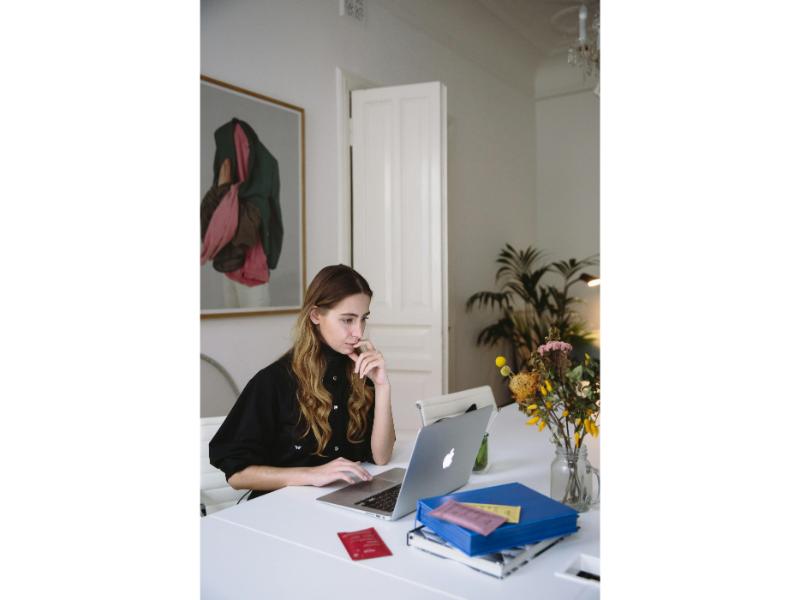 multiple loans woman looking at laptop