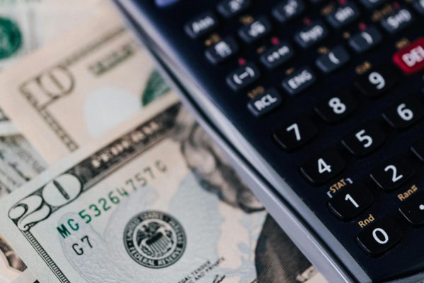 budgeting best practices image of calculator and money