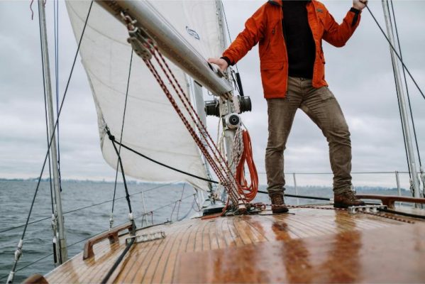 big purchases image of man on sailboat