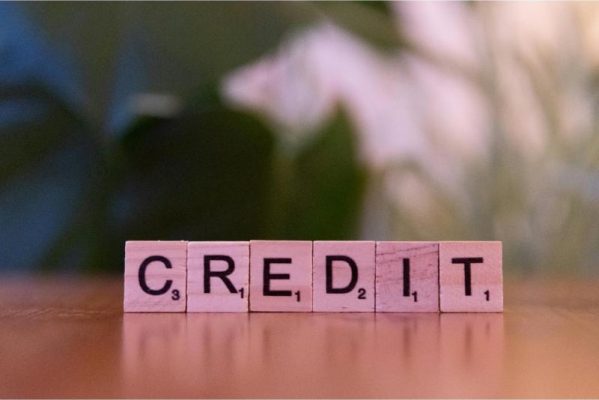 build your credit image of the word credit on tiles