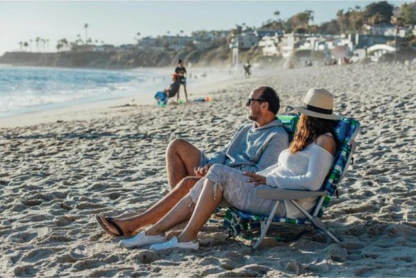 borrow for summer expenses image of couple on beach