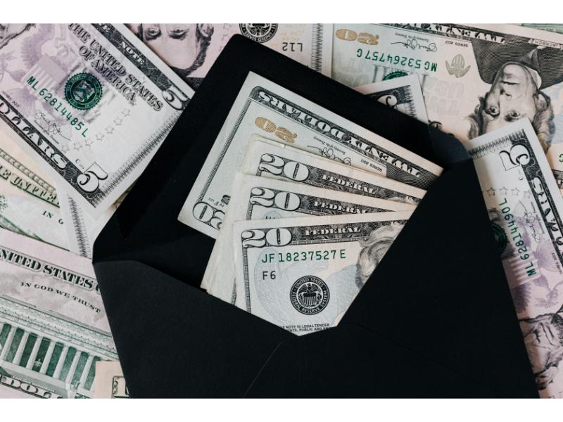 debt repayment image of money in an envelope